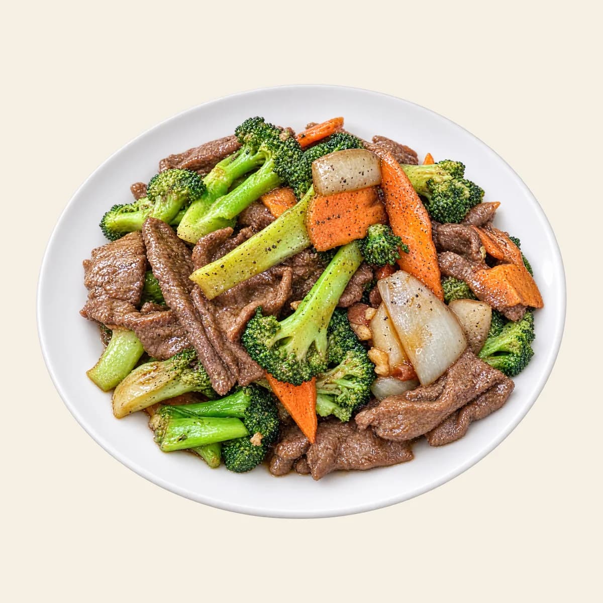 Beef with broccoli and carrots on a white plate