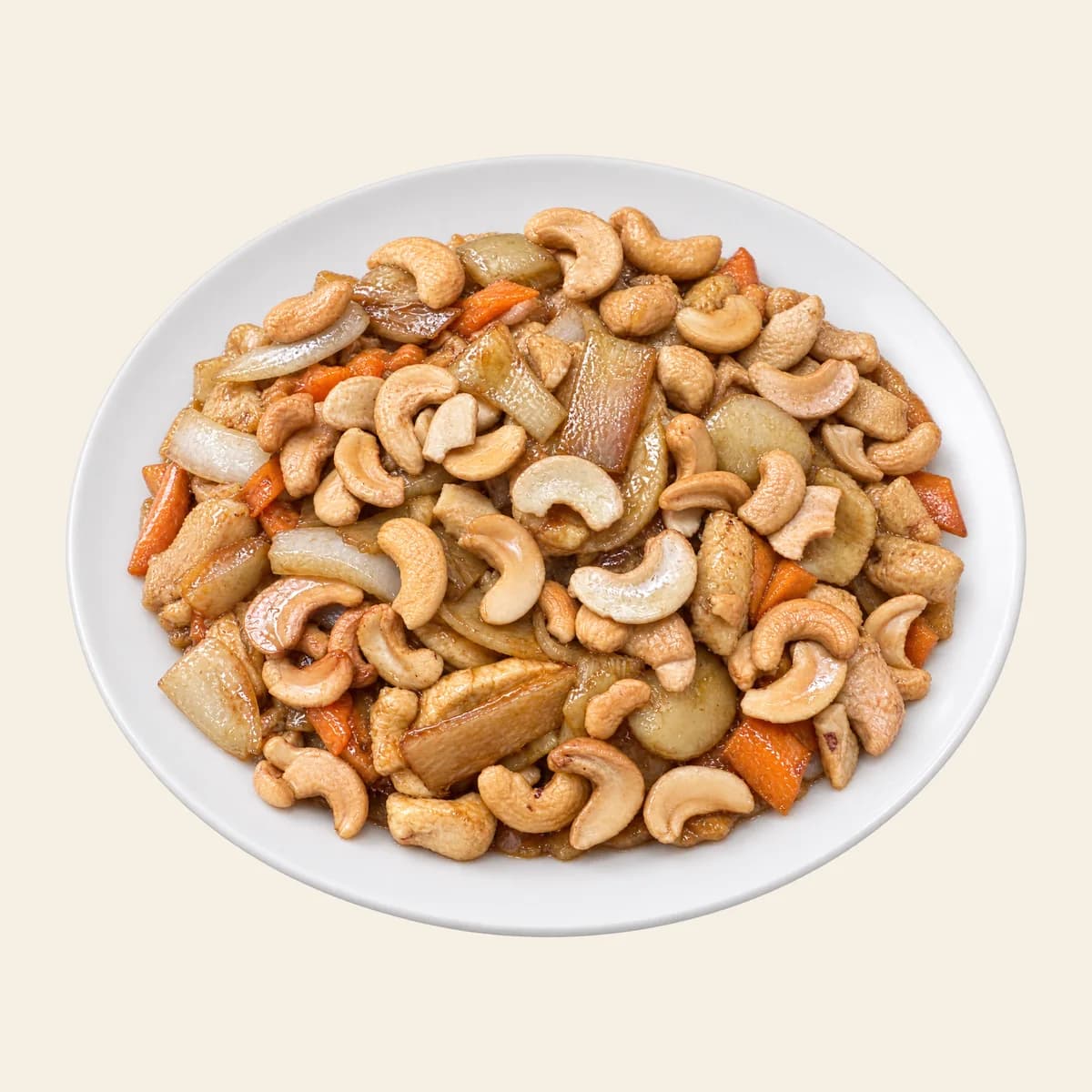 Cashew chicken with vegetables on a white plate