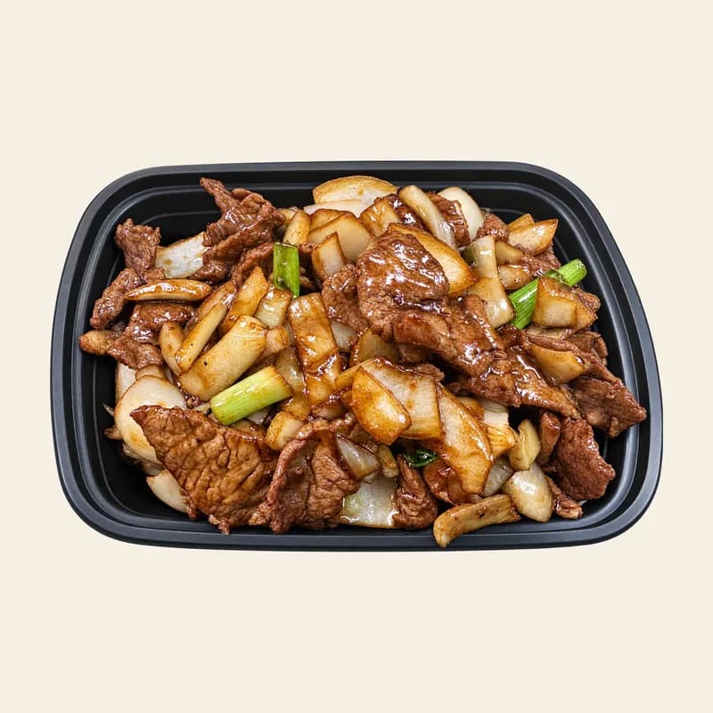 Mongolian beef with onion and scallion in a take-out tray